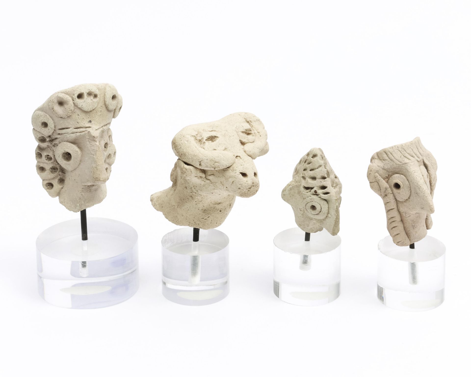 Syrian-Hittitic, four terracotta heads of fertility Idol, ca. 2nd Mill BC;