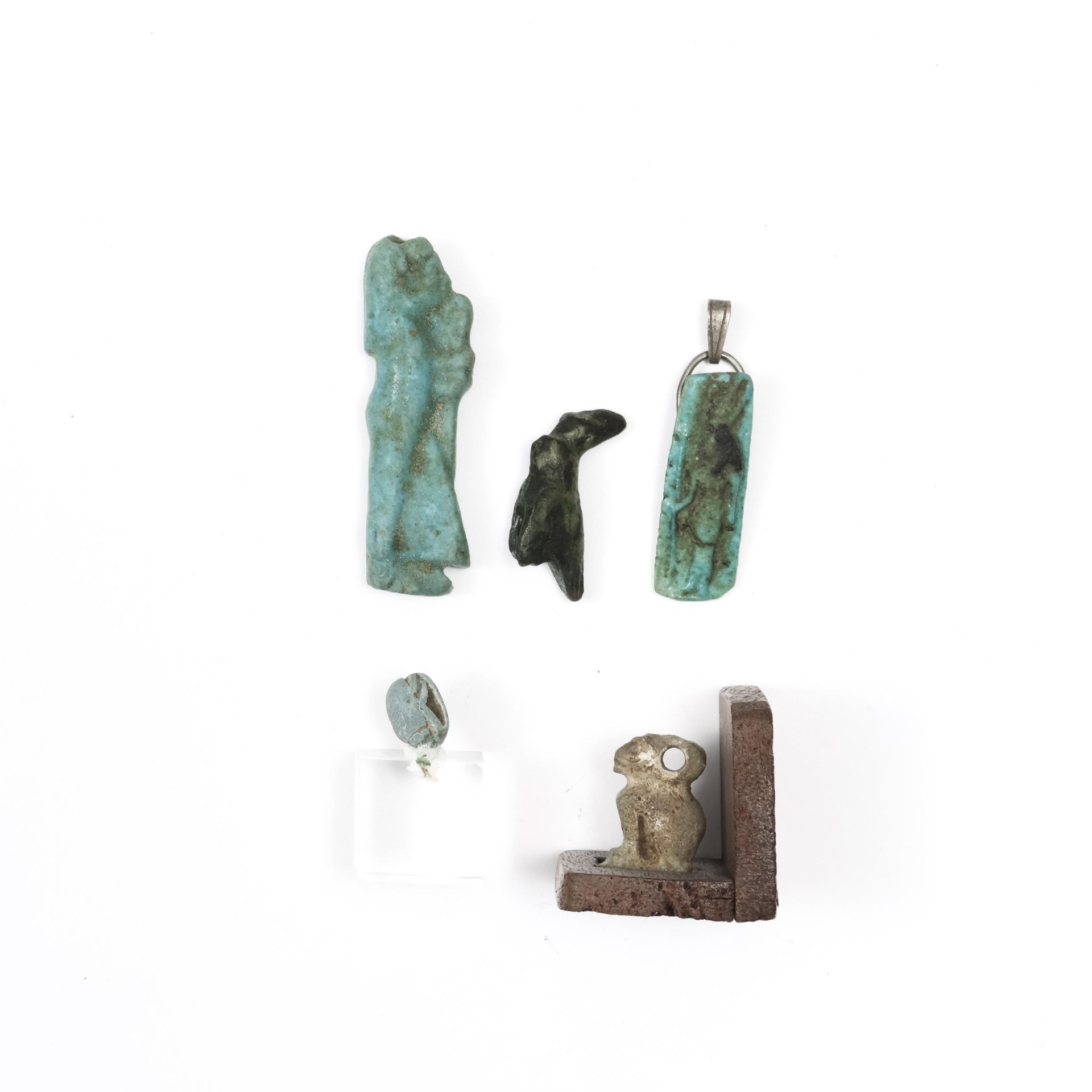 Egypte, four faience amulets and a bronze Horus, Late Period.