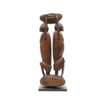 P.N. Guinea, Sepik, receptacle on top of two male squatting figures; herewith a Lower Sepik small ma