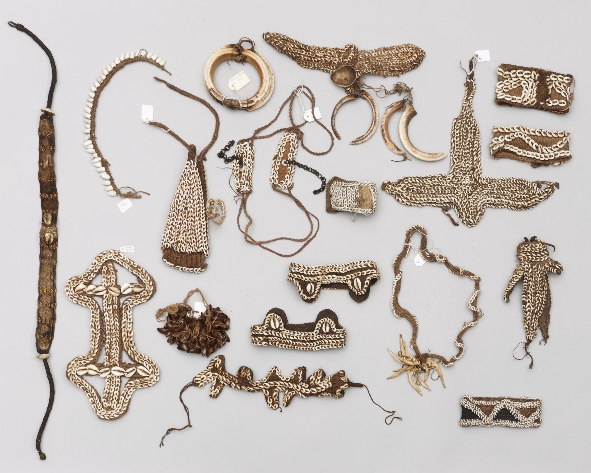 P.N. Guinea, an assorted collection of ornaments, mainly consisting of braided plant fibre material 