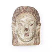 Italy, a Etruscan terracotta antifix in the form of a female head, ca. 5th century BC. (restored)
