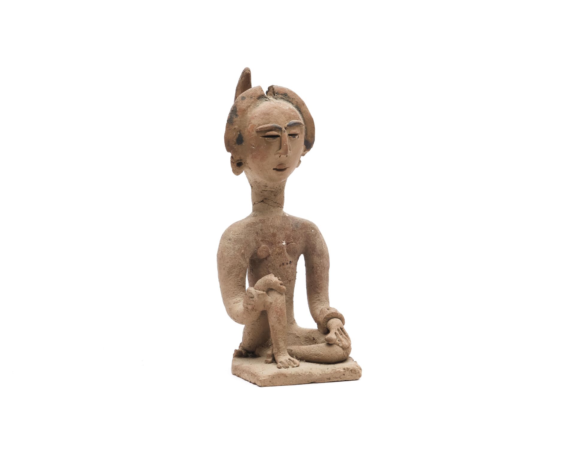 Sulawesi, Makassar, terracotta female figure, some details in black.