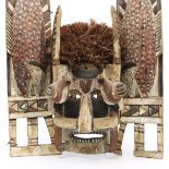 New Ireland, a painted wooden funeral Malangan mask,