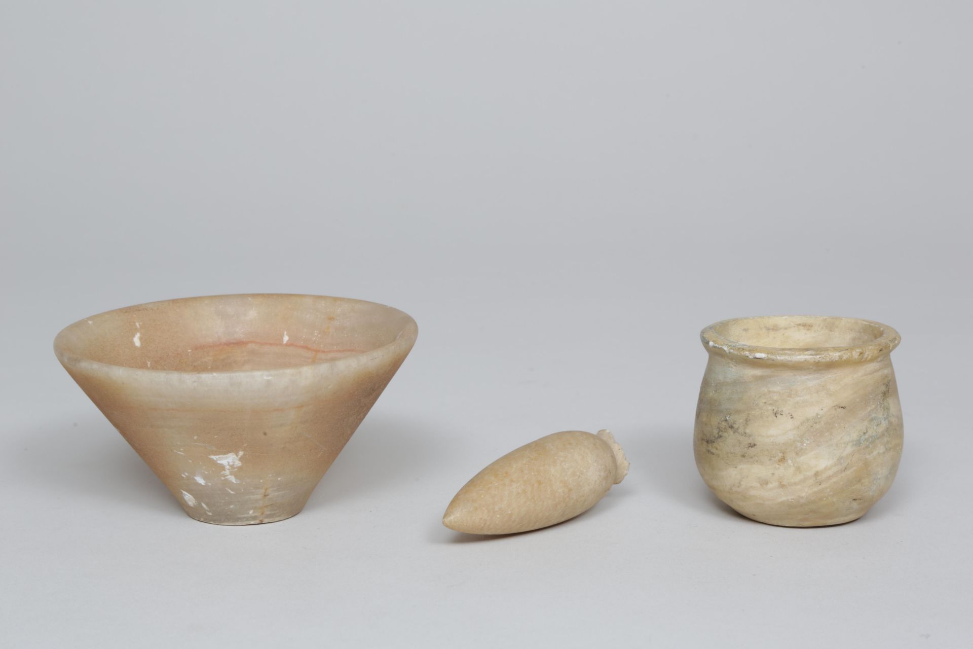 Three albast containers, possibly antique.