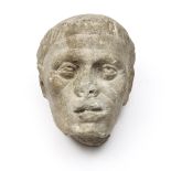 A marble male head. SALE ROOM NOTICE: PROBABLY OF A LATER DATE AND NOT ROMAN PERIOD