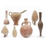 A collection of four Roman terracotta vessels, and three antique terracotta flasks, ca. 2nd century