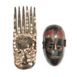 Mali, Bamana, ntomo mask, decorated with cowry shell and abrus seeds; herewith a black and red paint