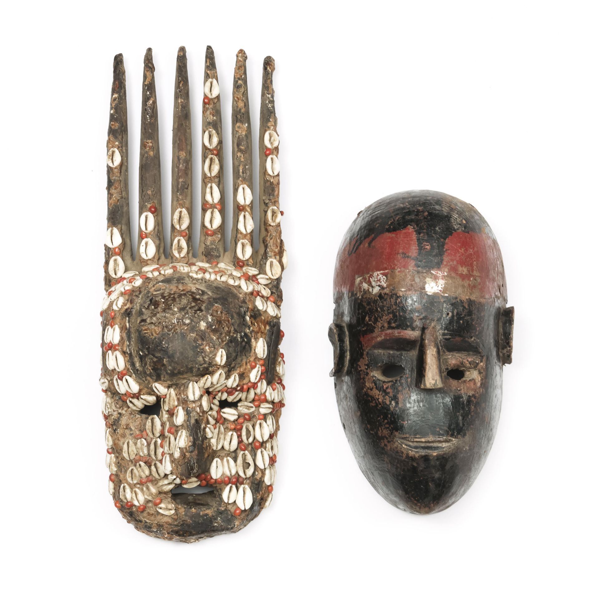 Mali, Bamana, ntomo mask, decorated with cowry shell and abrus seeds; herewith a black and red paint