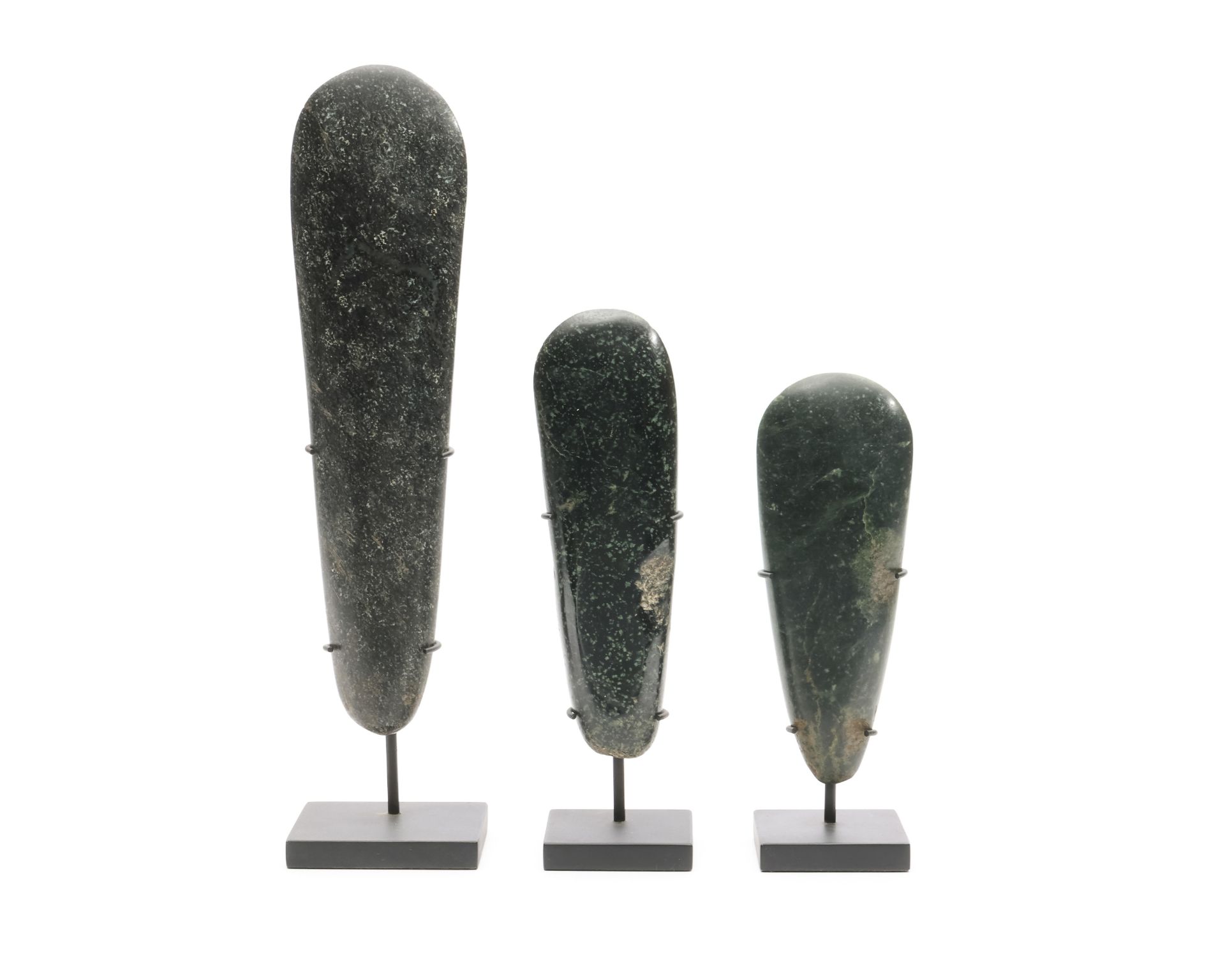 Papua, three stone axe blades