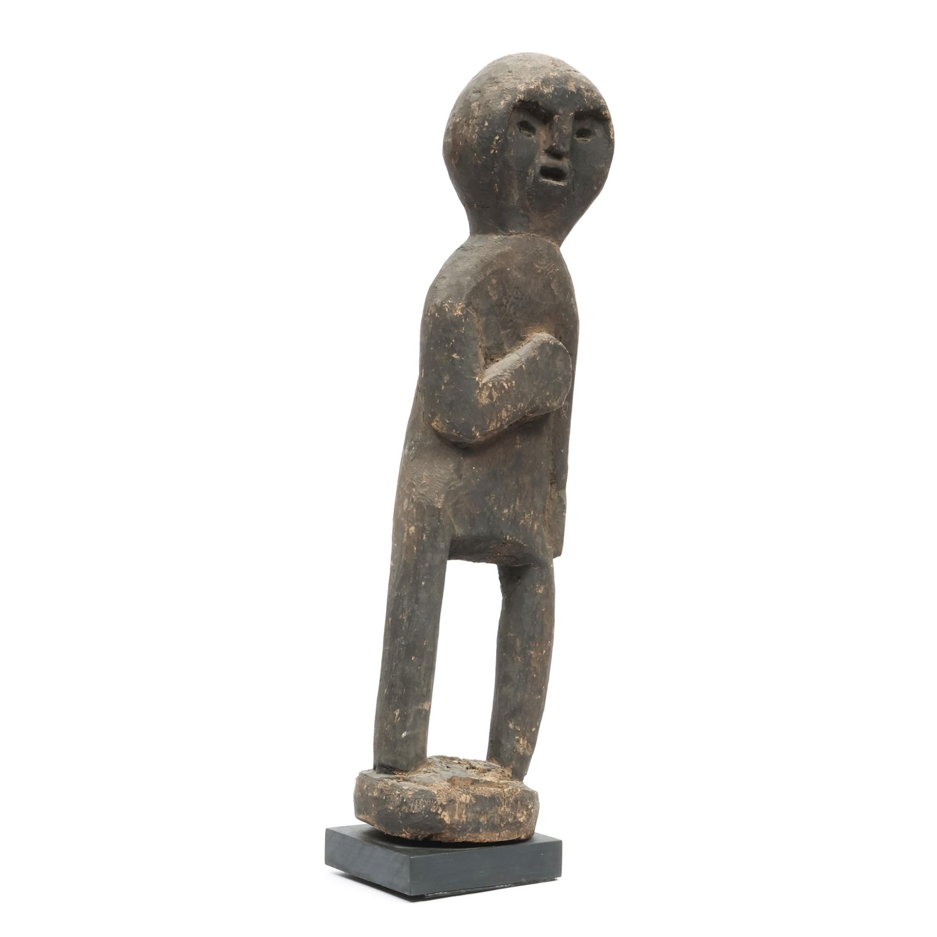 A standing blackened wooden figure