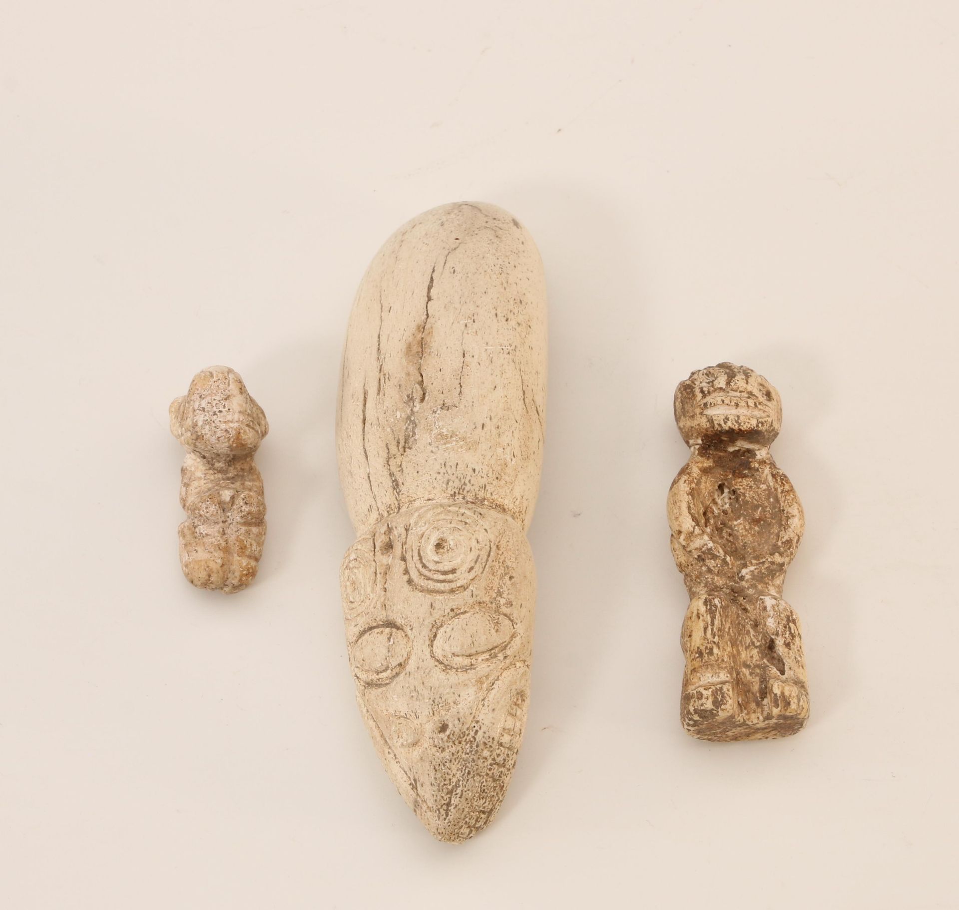 Haiti, Taino, a bone ritual spatula, a bone anthropomorphic amulet and figurine, ca. 1000-1500 AD.