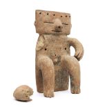 Colombia, Quimbaya, a terracotta seated slabfigure, 1000-1500 AD