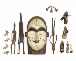 African mask, three iron figures and a selection of bone and ceramic amulets