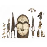 African mask, three iron figures and a selection of bone and ceramic amulets