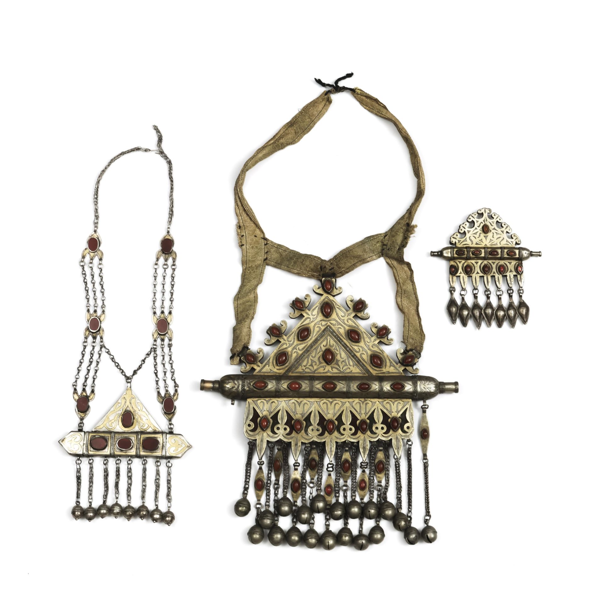 Turkmenistan, Tekke, three silver, ormolu and cornelian, glass amulet holders as pendants, tumar.