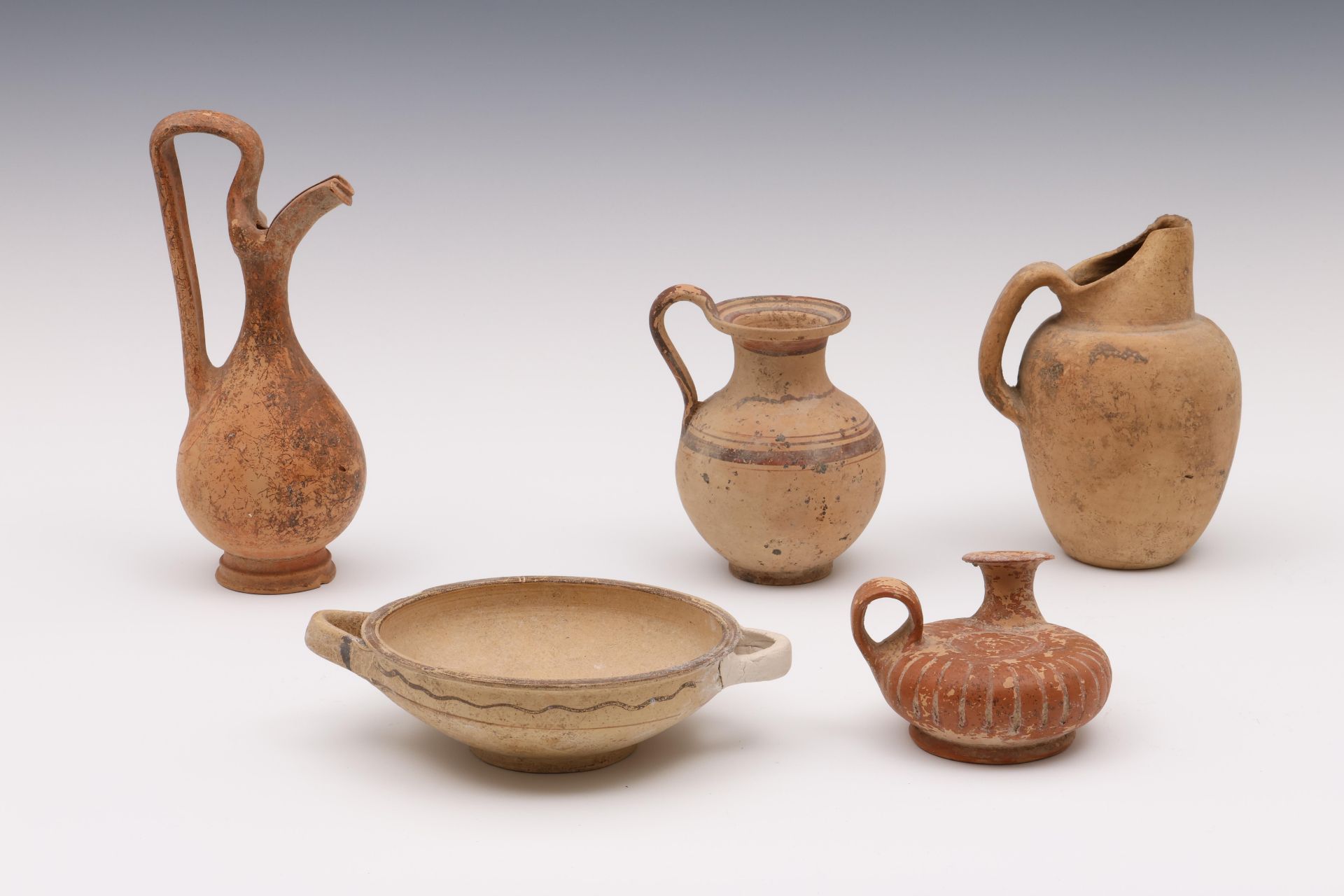 A collection of five terracotta objects, ca. 5th century BC and later;