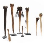 P.N. Guinea, a collection of six bone daggers and two bone spatulas.
