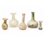A collection of four Roman glass flasks, ca. 3rd century;