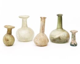 A collection of four Roman glass flasks, ca. 3rd century;