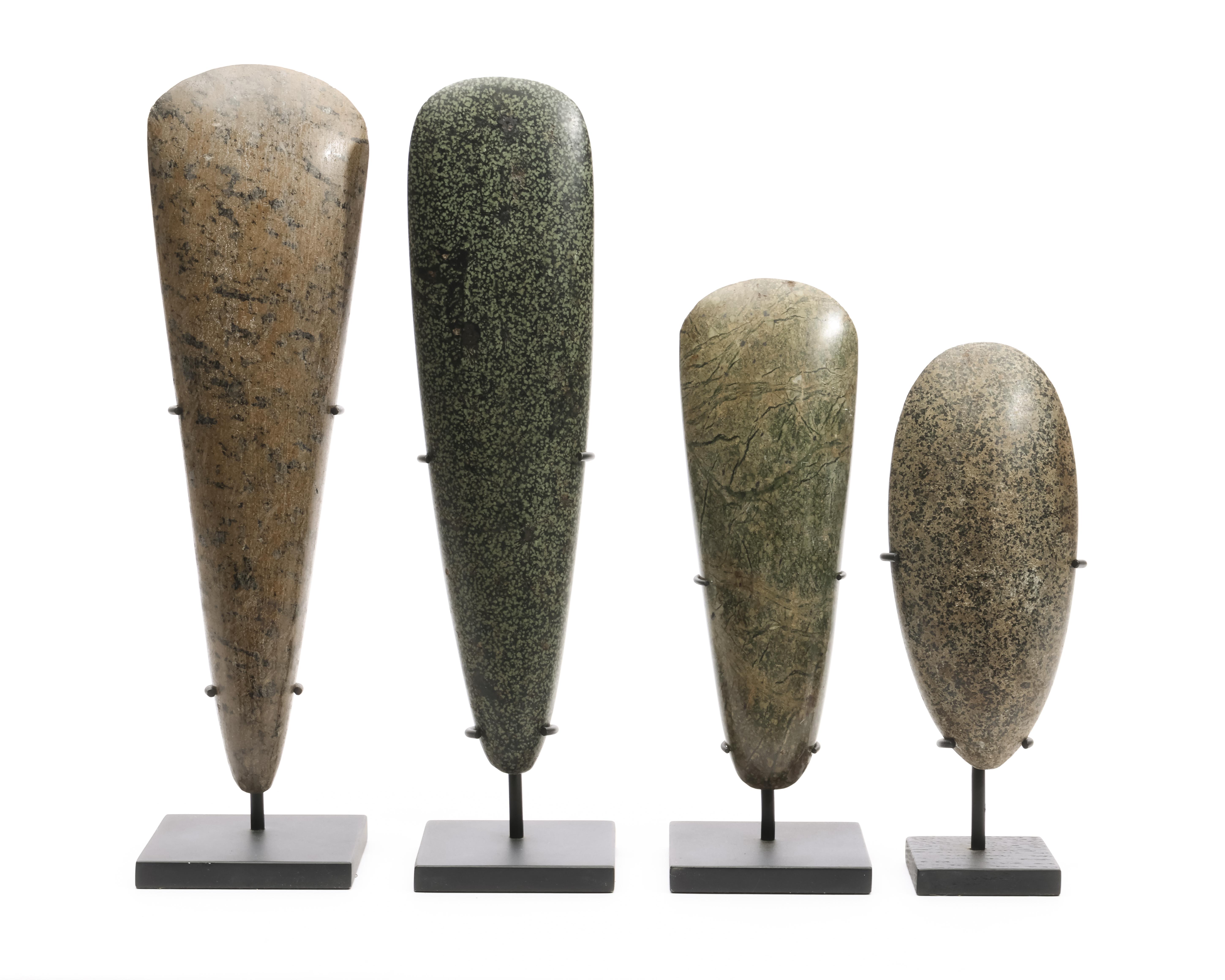 Papua, a collection of four stone axe blades