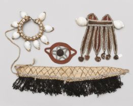 P. N. Guinea, a collection of various plant fibre and shell ornaments.
