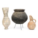 Earthenware jug, a black pottery bowl and a grey pottery high vase, all antique;