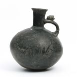 Peru, Lambayeque, a black pottery vessle with handle, 1100-1400