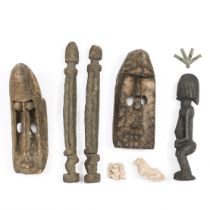 Mali, a collection of two Dogon masks and three anthropomorphic figures.