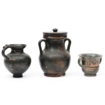 Greek, Attic black glaze cup with lid, a jar with handle, possibly Attic and an Appulian miniature k