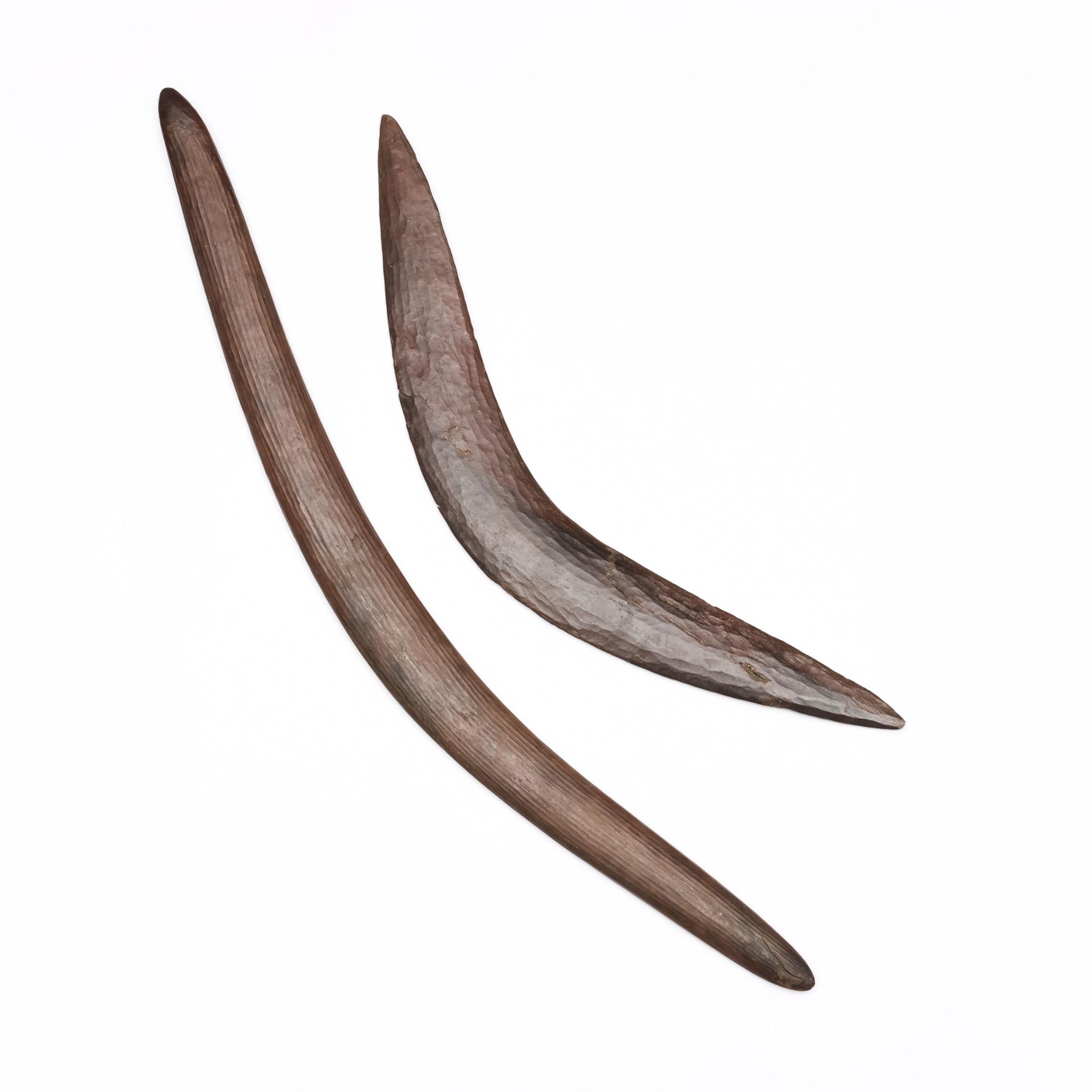 Australia, two Aboriginal boomerangs, both with a notched pattern.