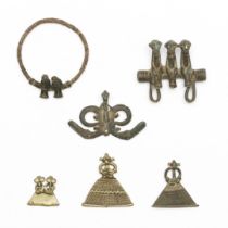 Ivory Coast, Senufo, three copper alloy amulets, a iron armlet with a pair of figures in copper allo