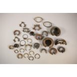 A lot of various West African metal armlets.