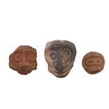 P.N. Guinea, Sepik River, three terracotta faces.