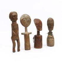 Ghana, a collection of three Asante and Fante akuaba puppets and a female ancestor figure.