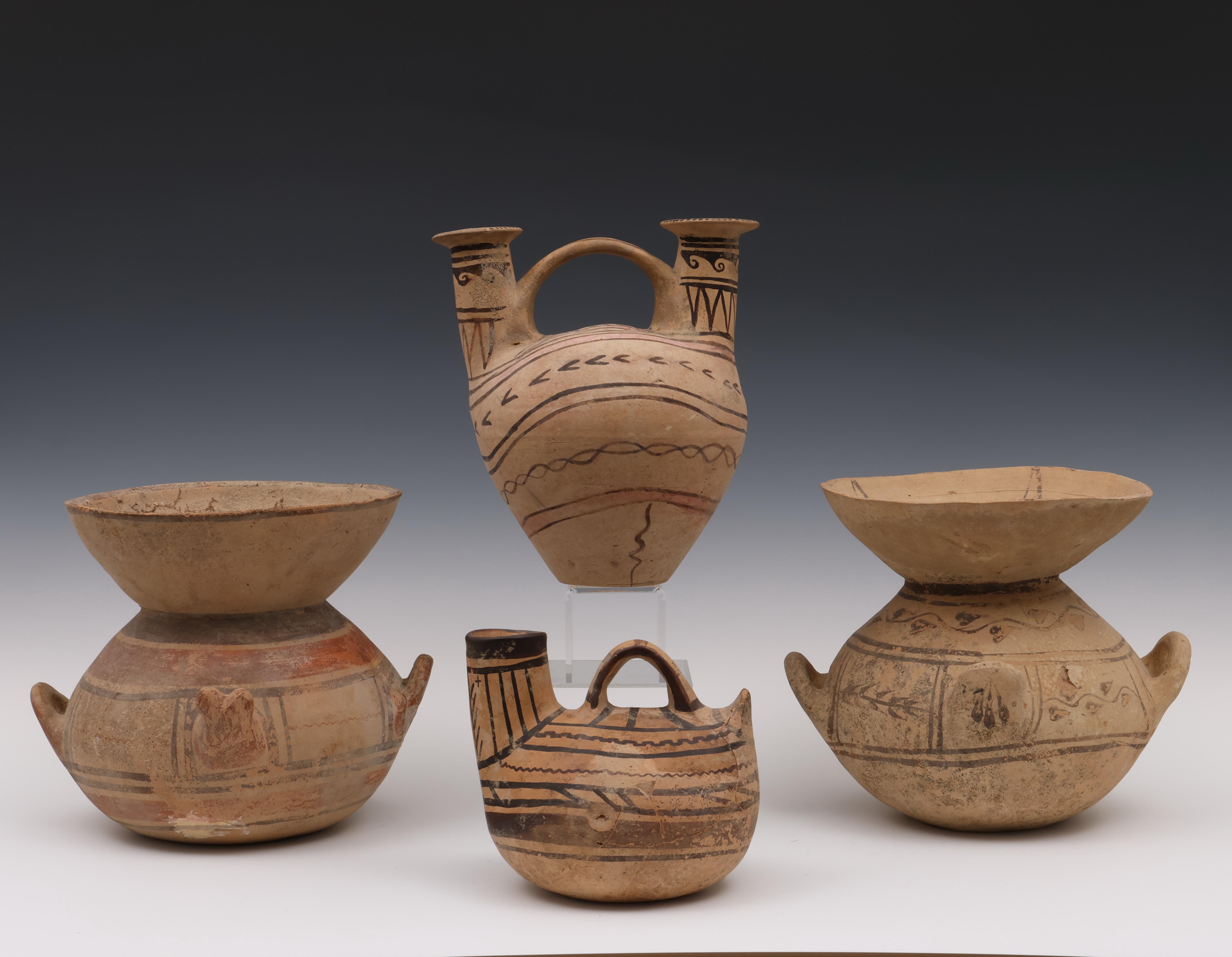 Greece, two Daunian terracotta funnel kraters and two askos, 6th-5th century BC;