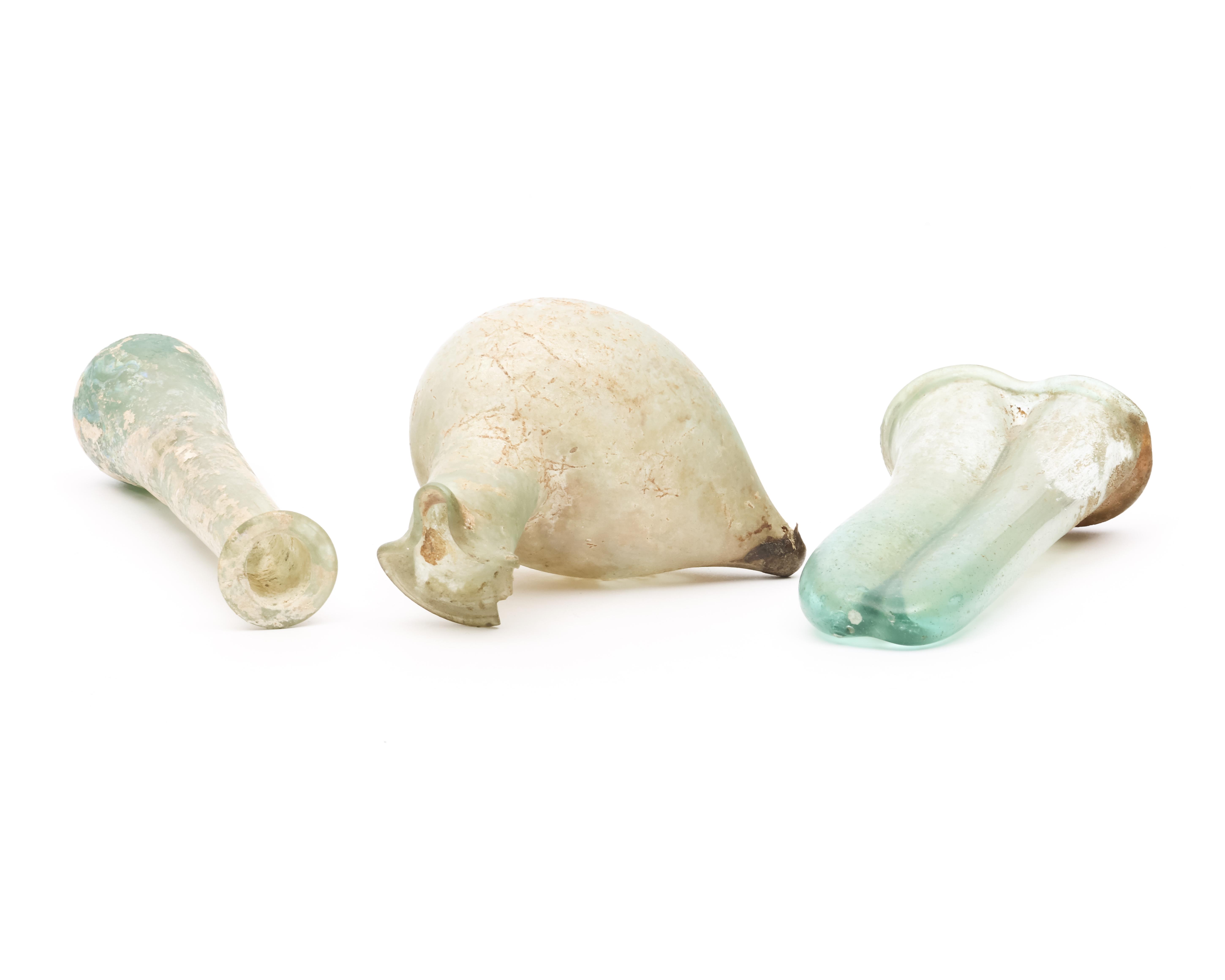 A Roman glass double balsamarium, a bird sprinkler and a long flask, 3r Century BC - Image 4 of 5