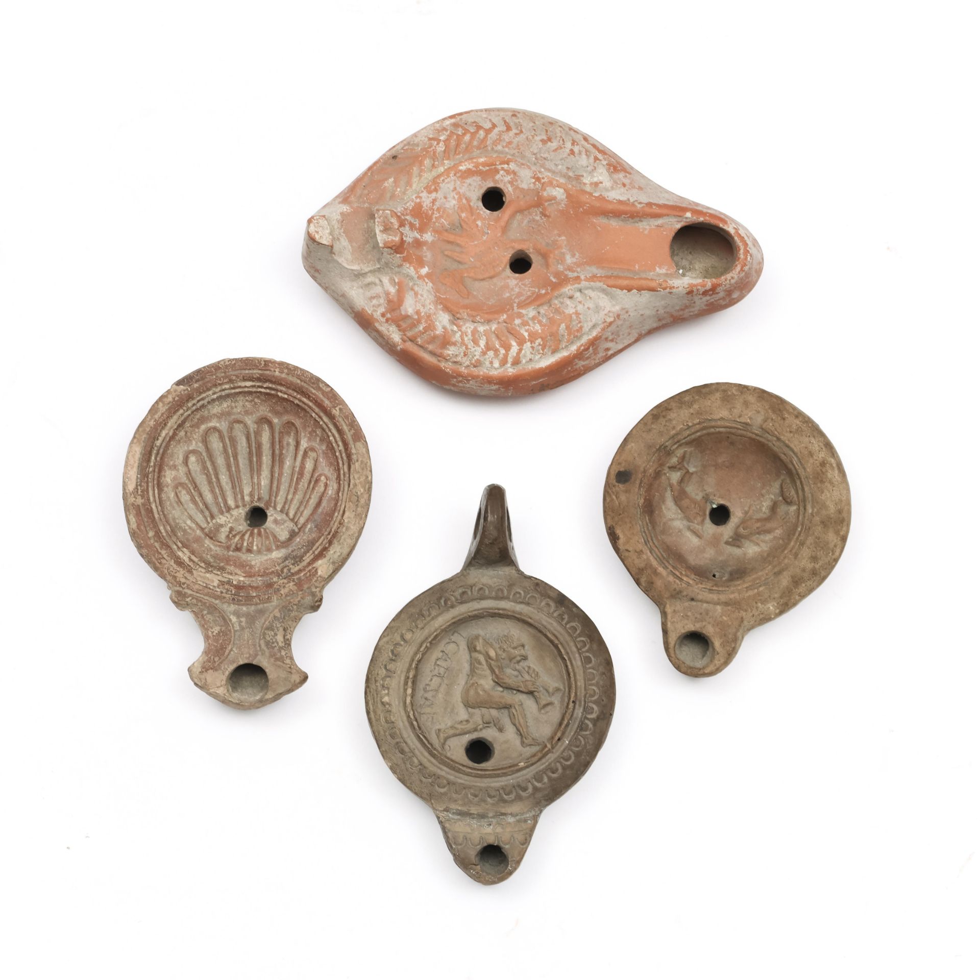 A collection of four Roman terracotta oillamps, ca. 2nd century AD,