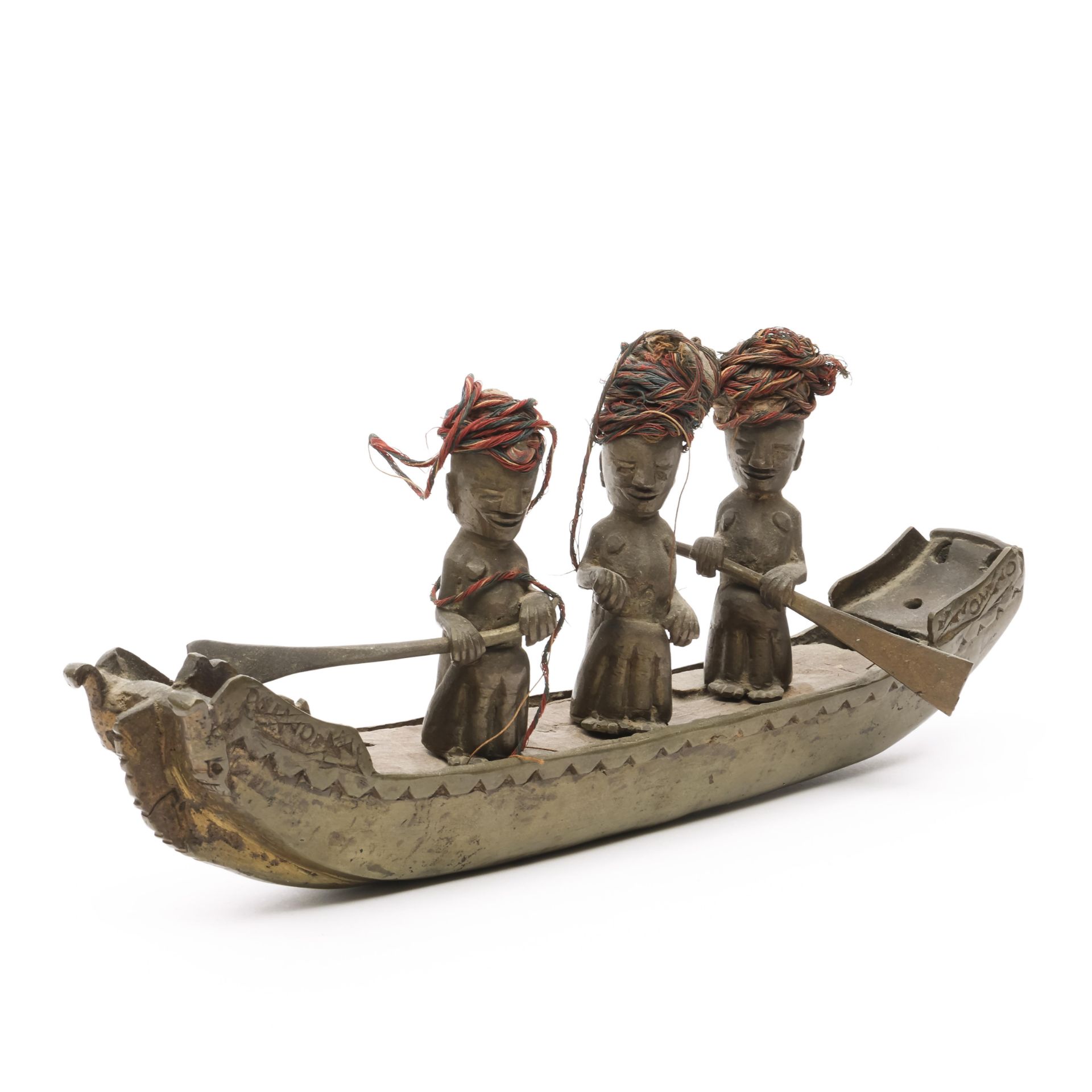 Sumatra, Batak, a bronze miniature boat with three ancestor figures, ca. 1900.