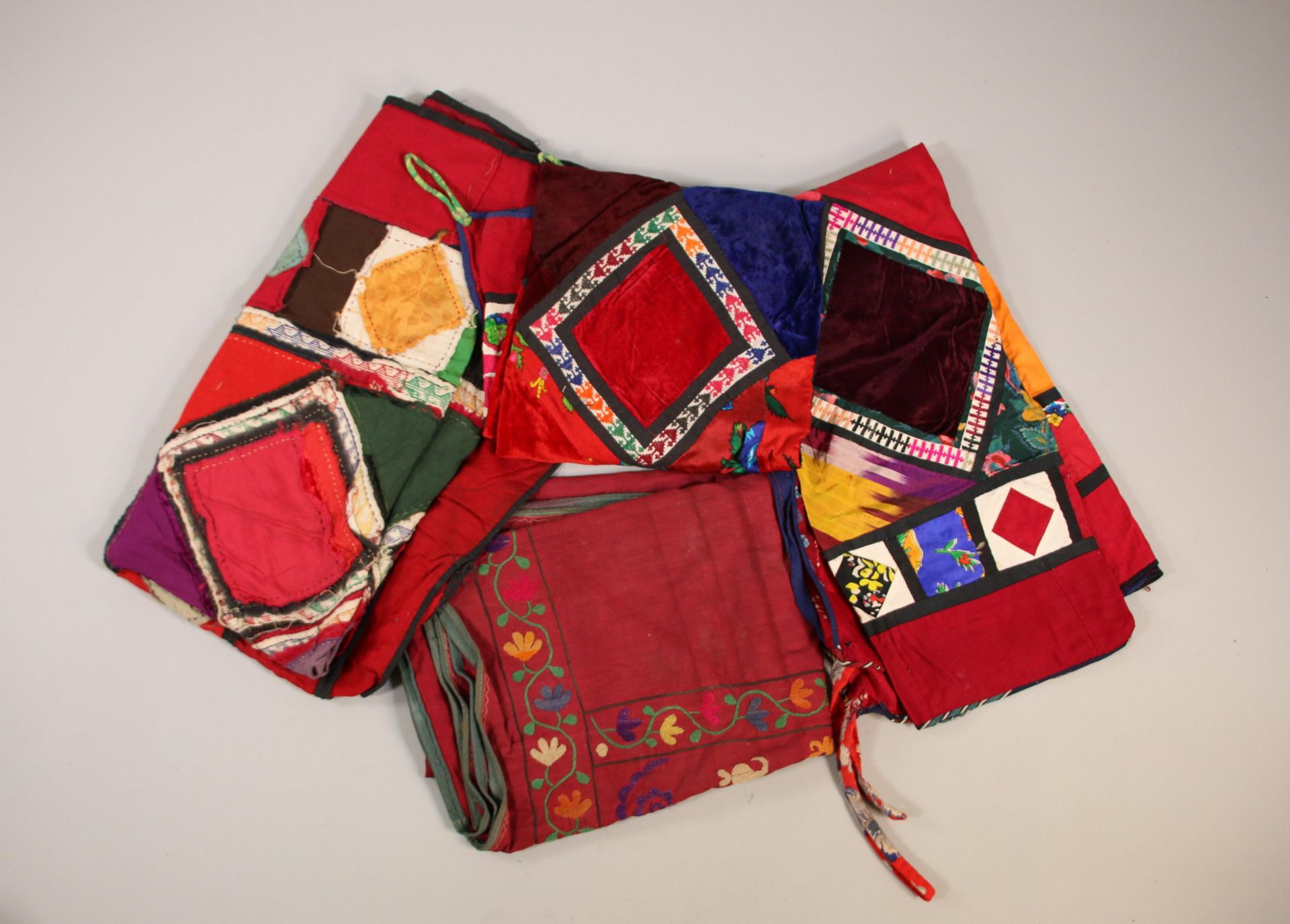 Usbekistan, a collection of six patchwork tent hangings and a embroidered tent hanging.