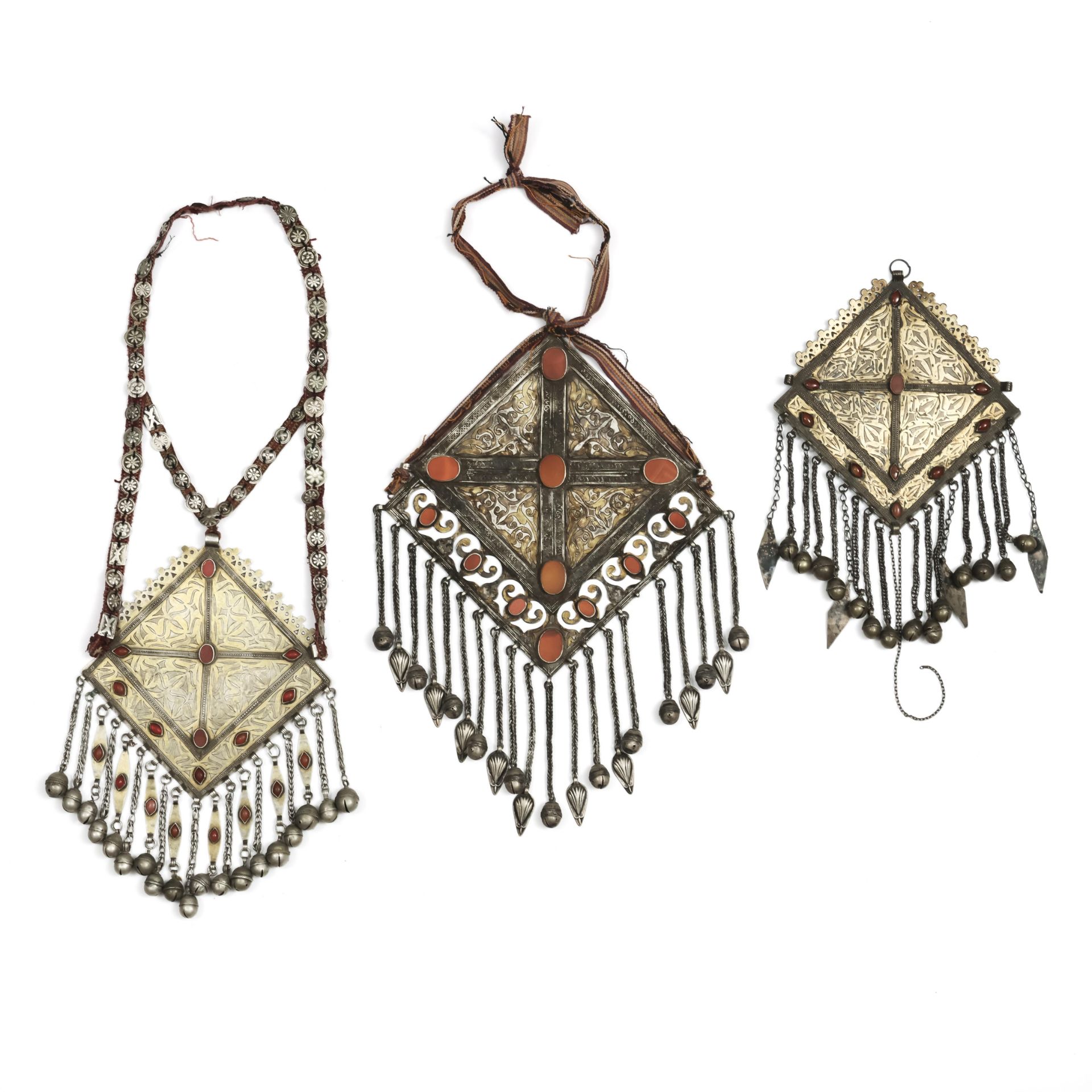 Turkmenistan, Tekke, three silver gilt-silver and cornelian diamond-shaped pectorals with pendants, 