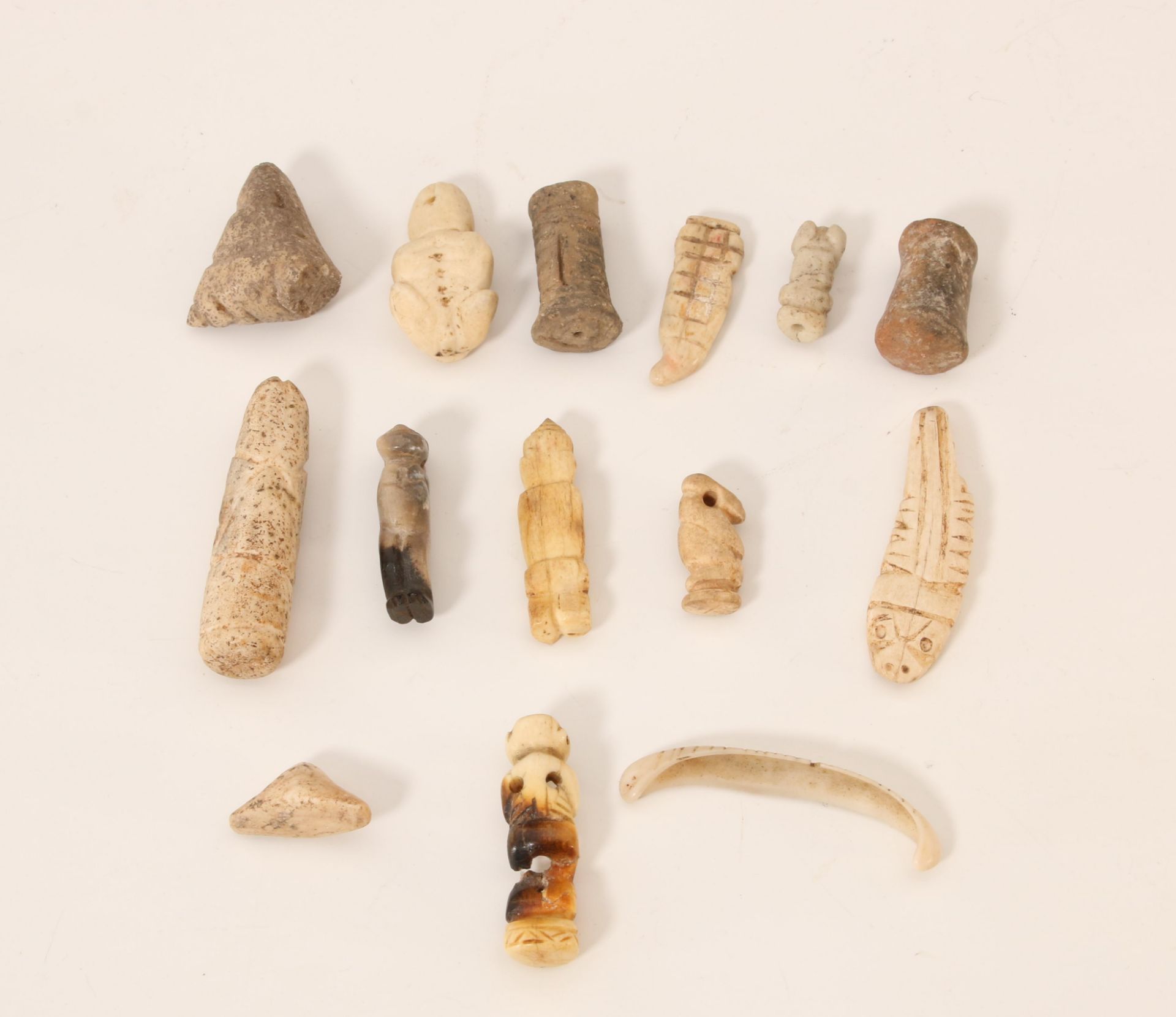 A collection of stone and bone objects, some Taino from ca. 1000-1500 AD;