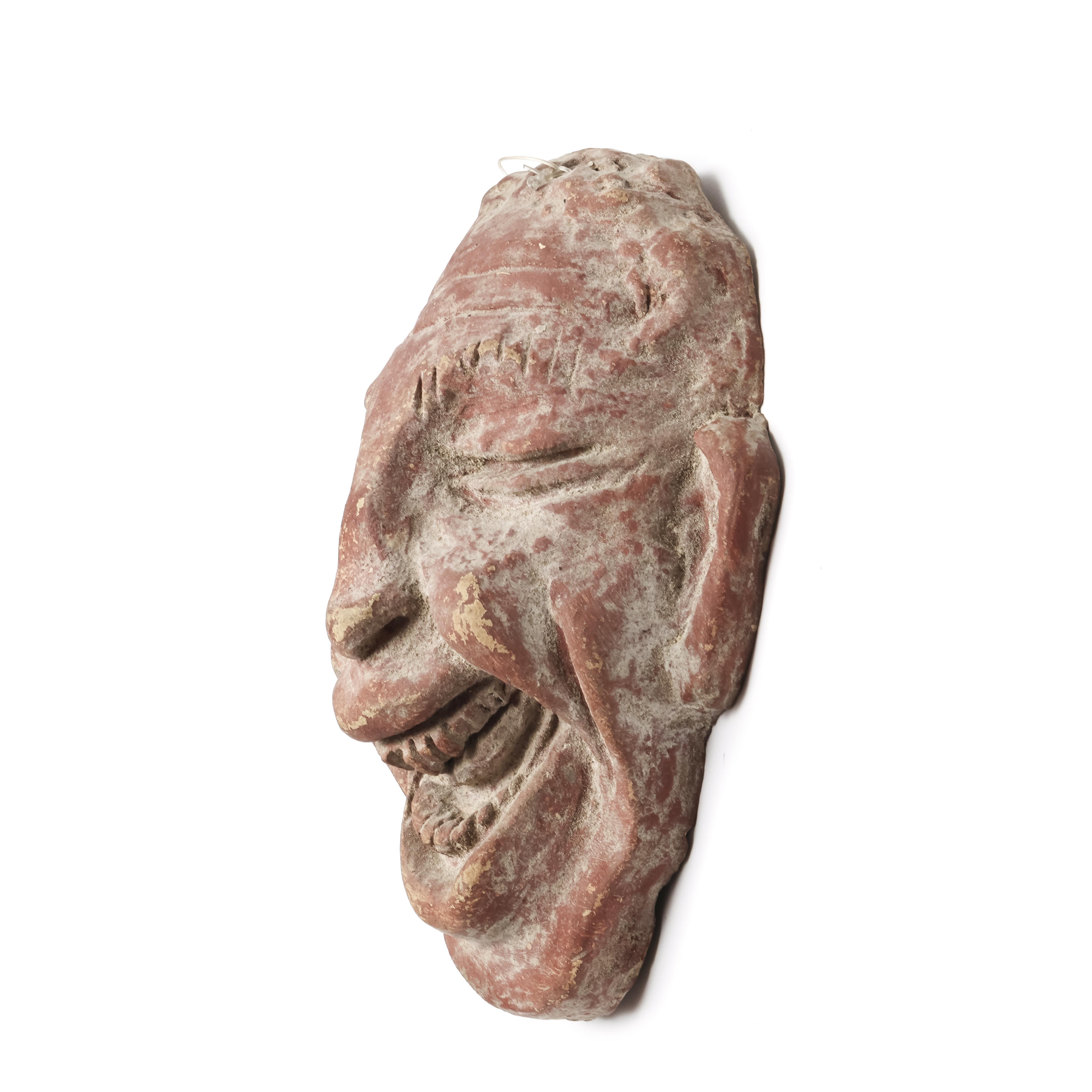 A red terracotta comic mask, possibly Hellinistic, ca. 1st century BC. - Image 2 of 4