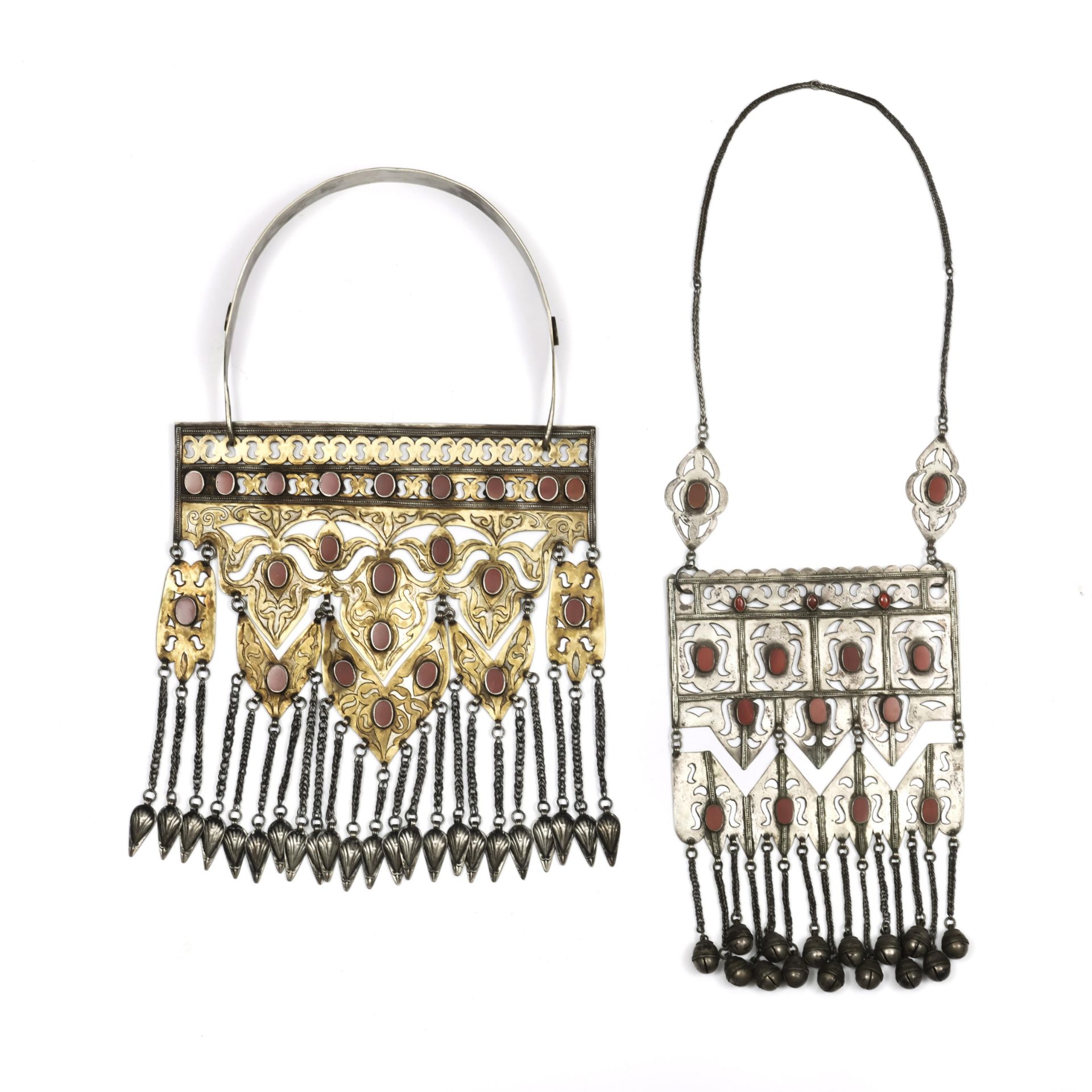 Turkmenistan, Tekke, silver, ormolu and cornelian openworked pectoral, bukau, silvered pendants and