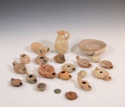 A collection of Roman terracotta oil lamps, two bottles and a bowl, ca. 2nd century AD;