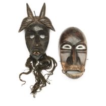 Ivory Coast, Dan, two masks;