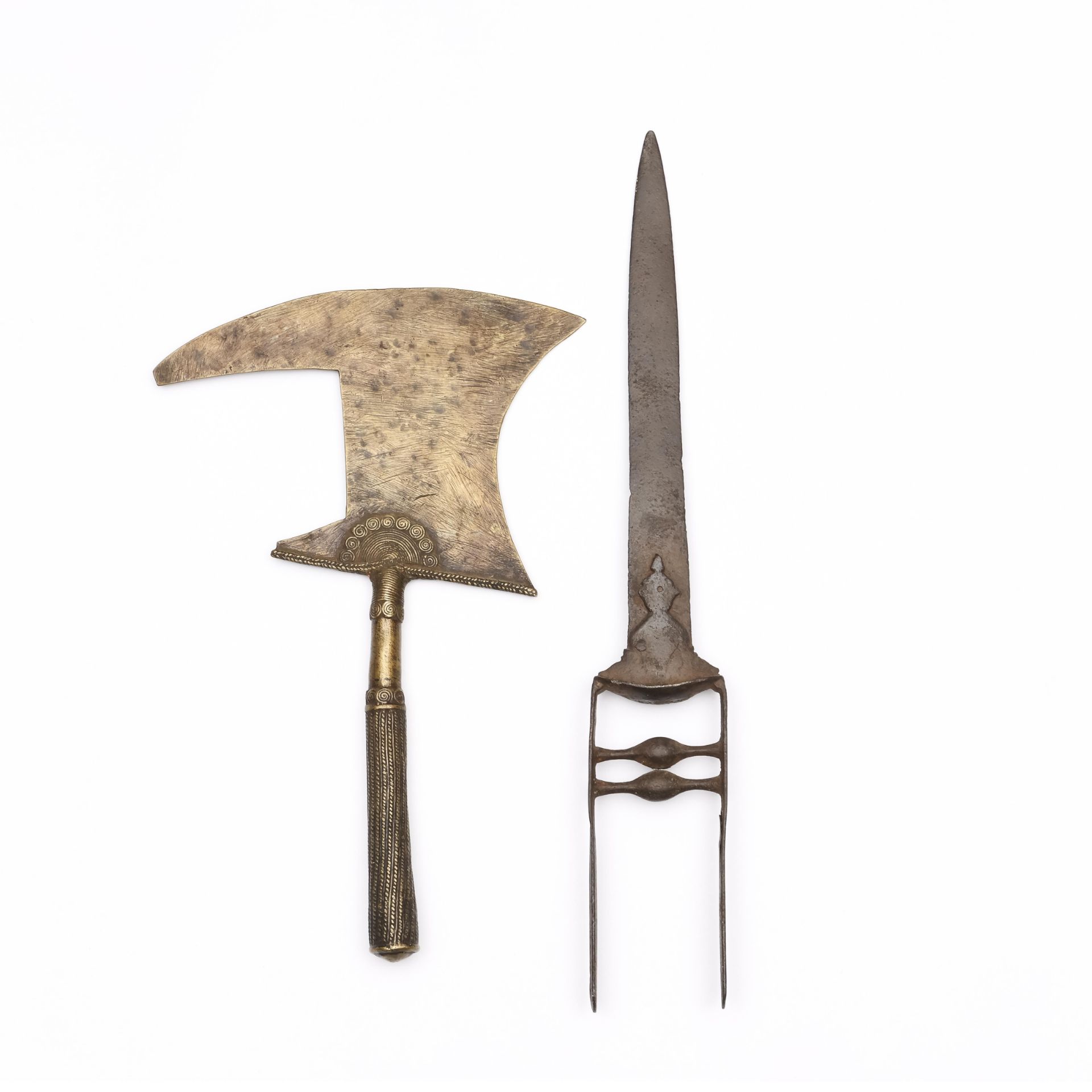 India, a dagger and an African brass axe.