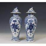 China, a pair of blue and white porcelain baluster vases and covers, 19th century,