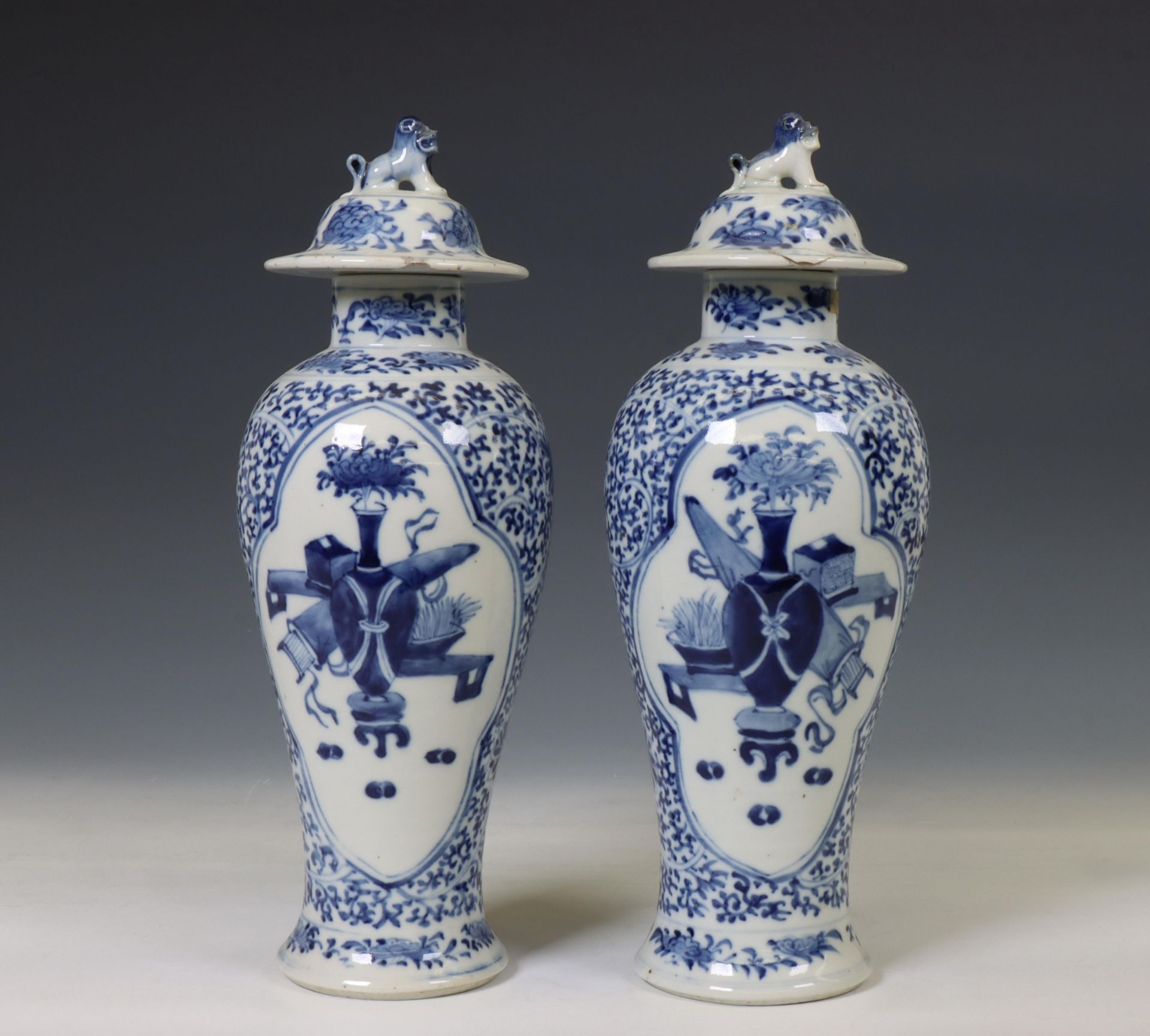 China, a pair of blue and white porcelain baluster vases and covers, 19th century,