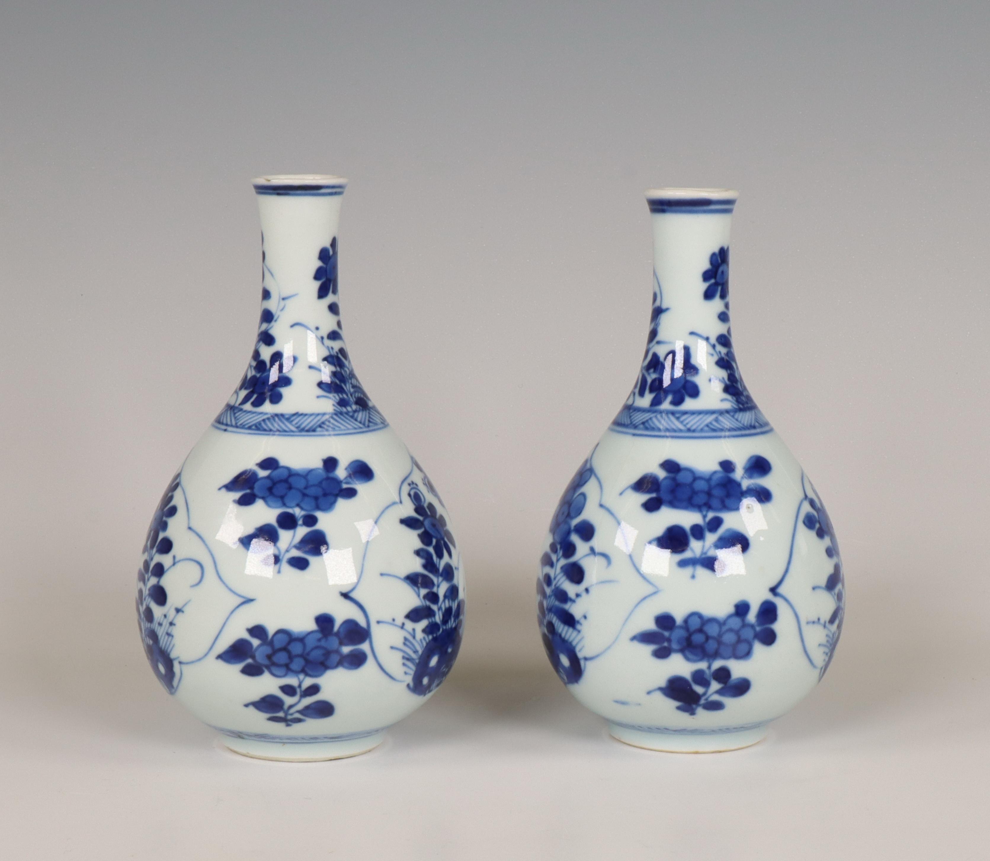 China, a pair of small blue and white porcelain bottle vases, Kangxi period (1662-1722), - Image 7 of 7