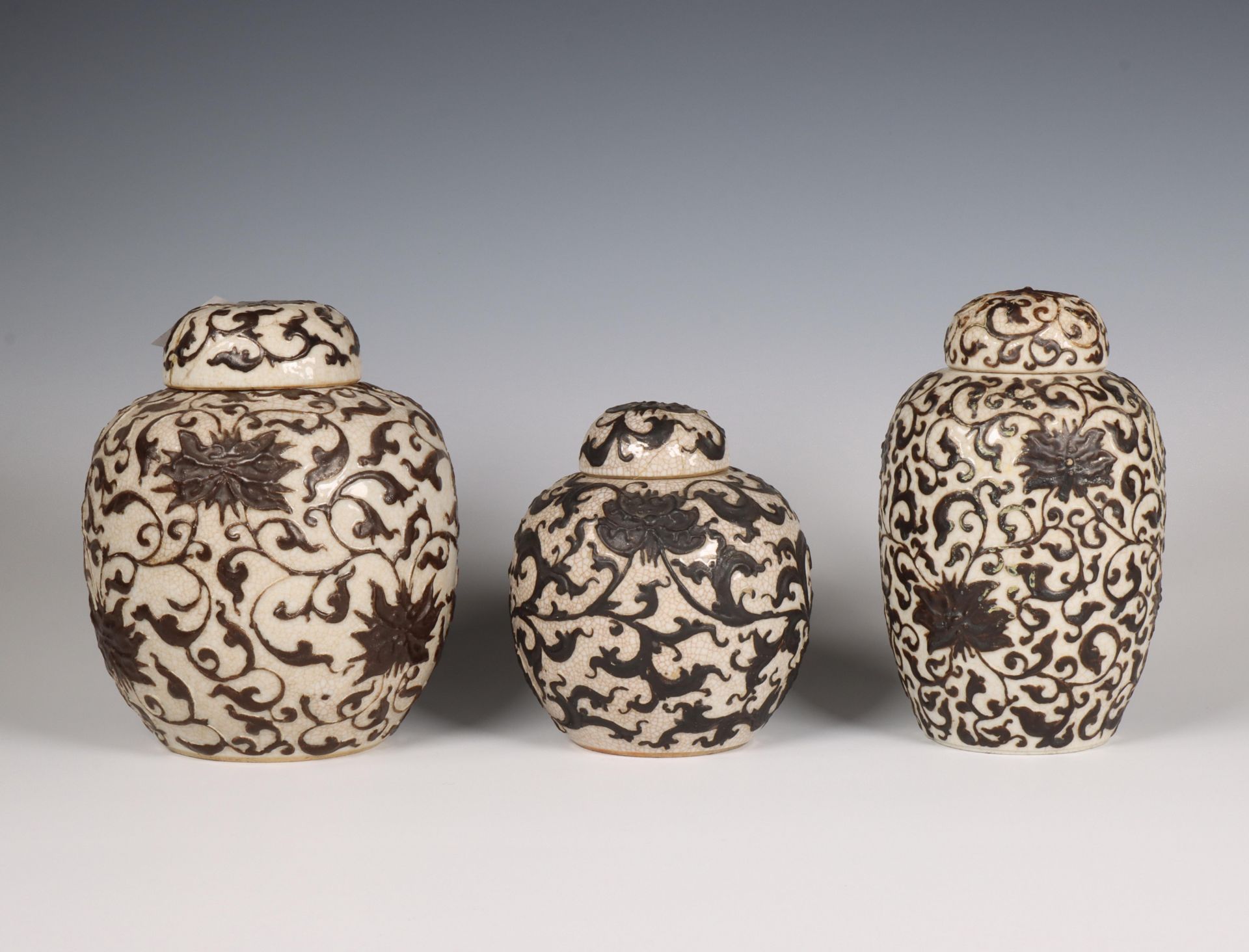 China, three crackle-glazed 'lotus' ginger jars and covers, 19th century,